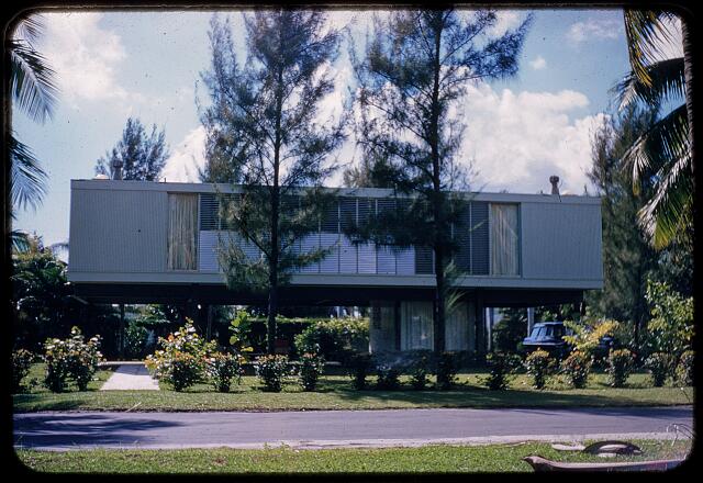 The Biggs House in the late 1950s, a period color slide showing the elevated pavilion behind Australian pines