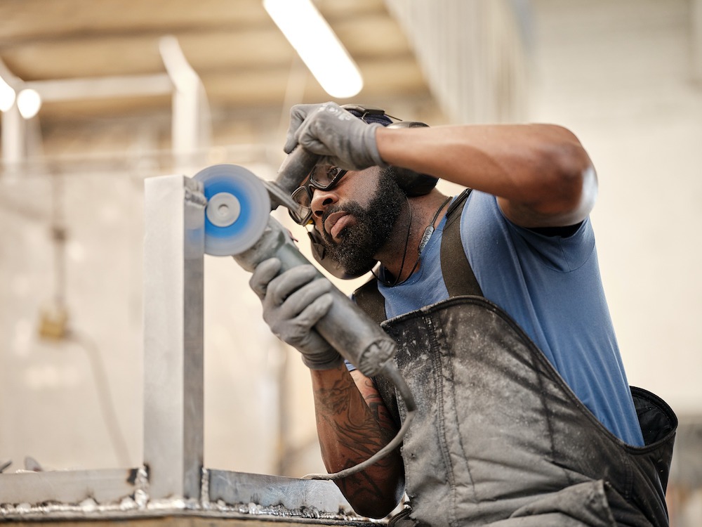 McKinnon and Harris working the aluminum photo Adam Ewing Photography copy