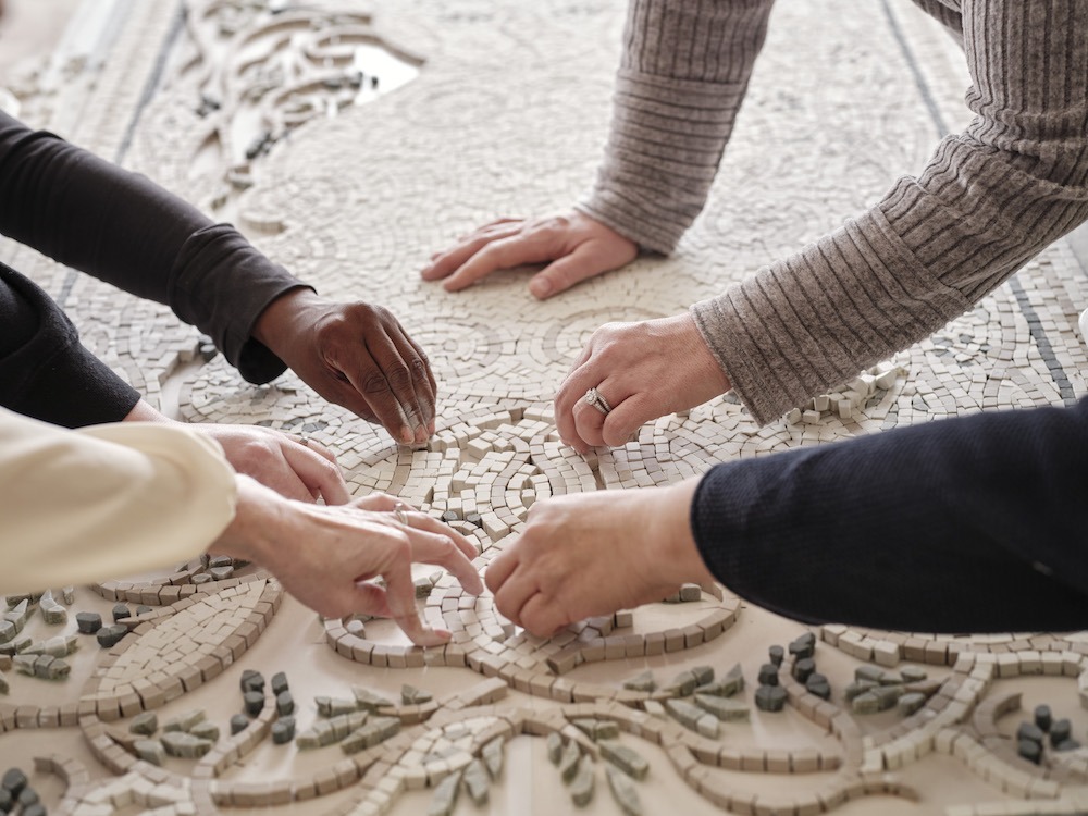 NRxMH mosaic table placing stones Adam Ewing Photography copy