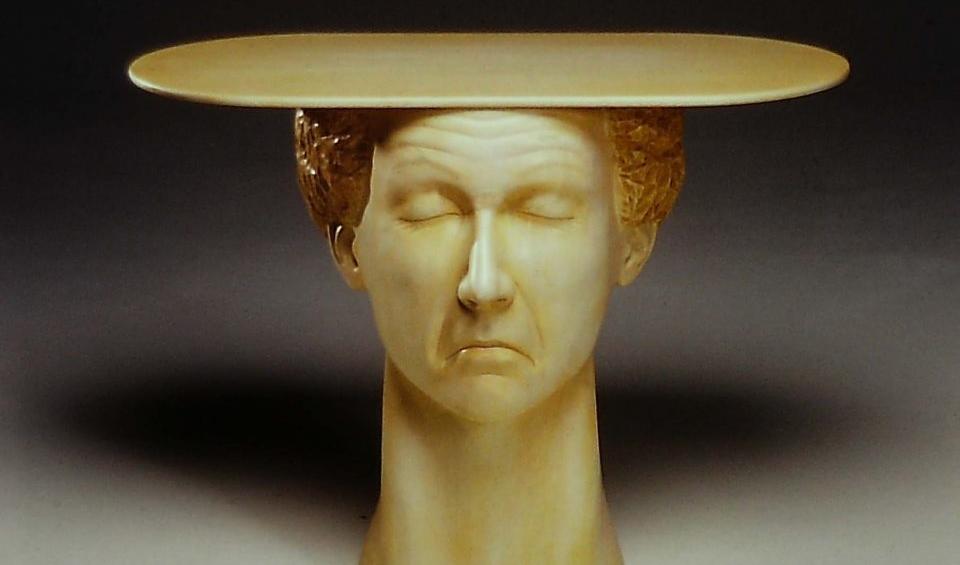 Now, 30 years later, the Winston-Salem native lives in the foothills of North Carolina, working solely as a sculptor dedicated to making wry and poignant commentaries on corporate America.