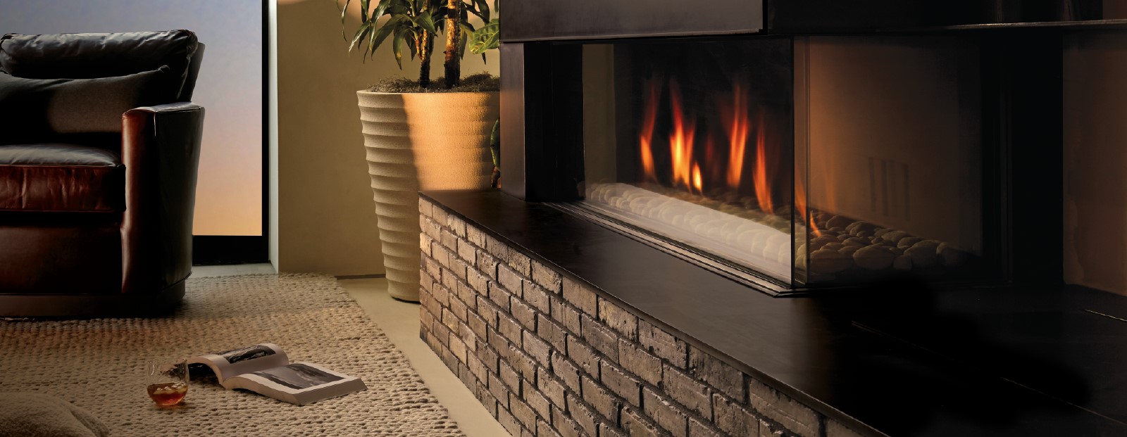 The company’s “Cool Wall” technology – the way the fireplace unit works as a cavity – heats up and draws room air in, with radiant heat off the glass.